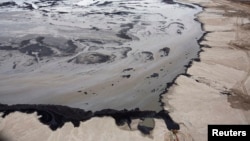 A Shell tailings pond at their tar sands operations near Fort McMurray, Alberta, Sept. 17, 2014. 