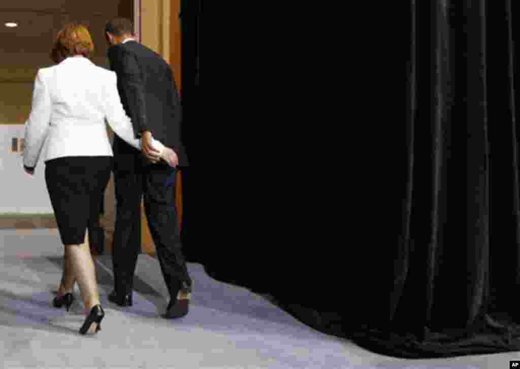 U.S. President Barack Obama and Australian Prime Minister Julia Gillard leave a joint news conference at Parliament House in Canberra, Australia, Wednesday, Nov. 16, 2011. (AP Photo/Charles Dharapak)