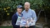 Hazel and David Brief hold a photo book made by their son Yona Brief, who died 14 months after Hamas militants shot him 13 times on Oct. 7, 2023, in Kfar Aza, at their home in Modiin, Israel, on Dec. 8, 2024.