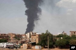 FILE—Smoke rises over Khartoum, Sudan, Thursday, June 8, 2023, as fighting between the Sudanese army and paramilitary Rapid Support Forces continues.