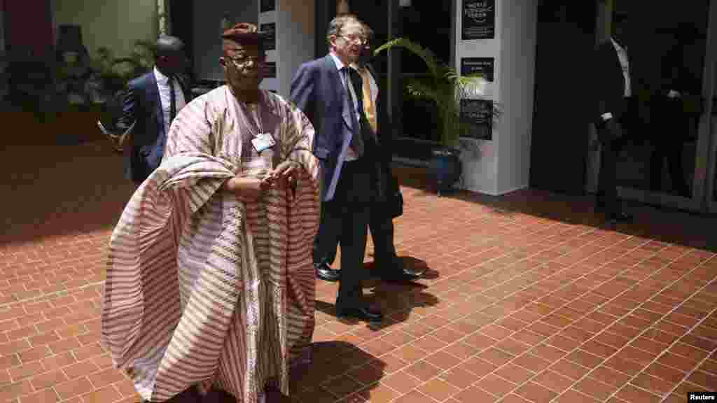 Oba Otudeko (2nd L), chairman of Nigeria's Honeywell Group, arrives for the World Economic Forum on Africa (WEFA) in Abuja, May 7, 2014. 