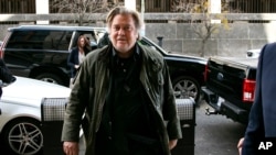FILE - Former White House strategist Steve Bannon arrives to testify at the trial of Roger Stone, at federal court in Washington, Aug. 20, 2020. 