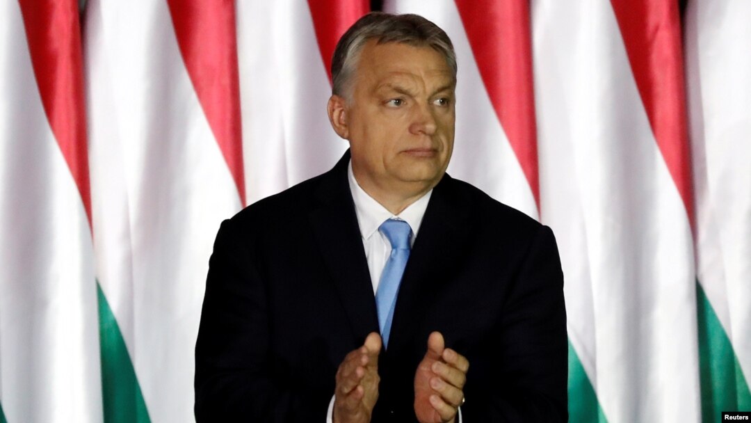 FILE - Hungarian Prime Minister Viktor Orban applauds as he presents the program of his Fidesz party for European Parliament elections in Budapest, Hungary, April 5, 2019.