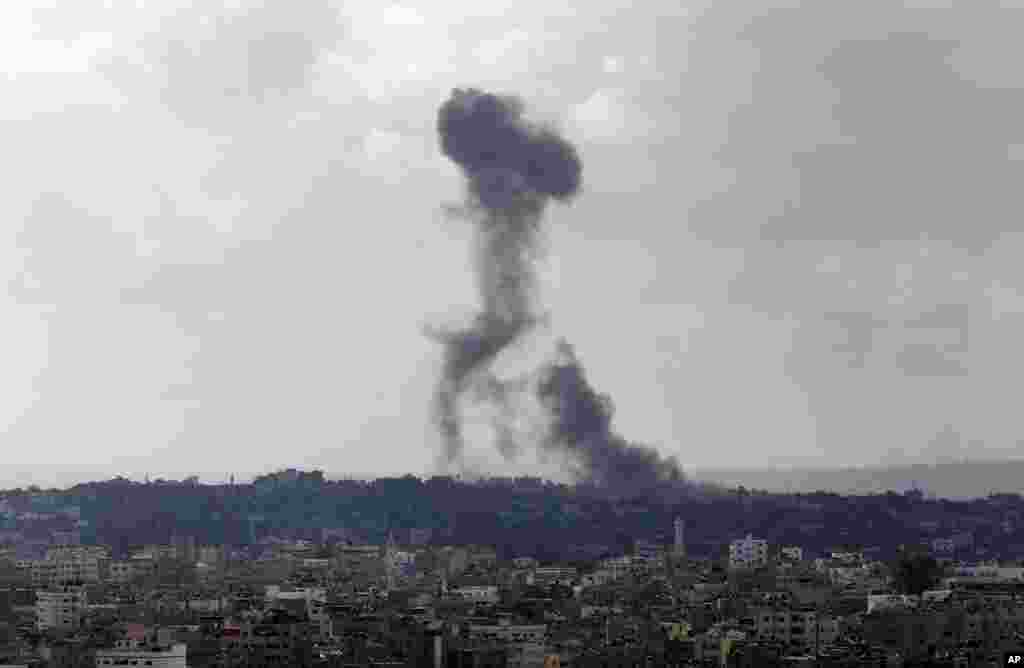 Smoke from an Israeli strike rises over the Gaza Strip, July 25, 2014.