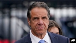 FILE - Former New York Governor Andrew Cuomo prepares to board a helicopter after announcing his resignation in New York, Aug. 10, 2021. On Saturday, he announced he is running for mayor of New York.