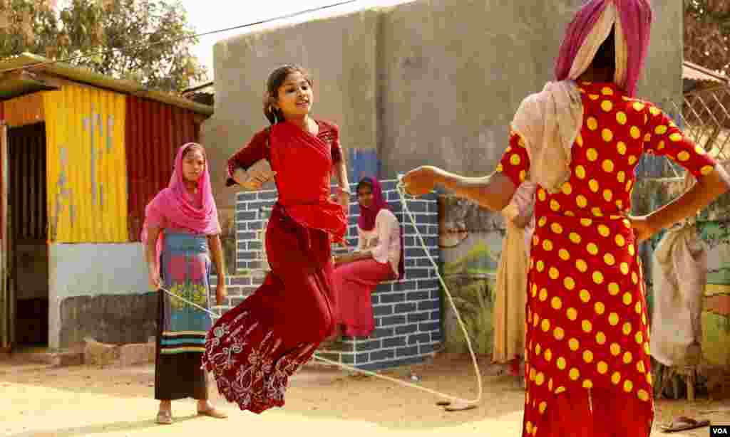 Rukshana Aktar, 12, jumps rope during lunch break at the Ashar Alo Junior Secondary School (Campus -02) in Kutupalong refugee camp Feb. 15, 2020. (Hai Do/VOA)