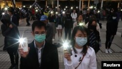 Una marcha de manifestantes en Hong Kong recordó al finalizar 2019 a los muertos y heridos en las protestas que sacudieron al territorios durante todo el año.