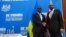 FILE — Britain's Home Secretary James Cleverly and Rwanda's Foreign Minister Vincent Biruta shake hands after signing a new treaty, in Kigali, Dec. 5, 2023. 