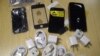 FILE - Counterfeit iPhone accessories are seen in this handout photograph taken Oct. 23, 2011. A Chinese national in the U.S. on a student visa was sentenced Tuesday for smuggling counterfeit Apple products from China into the U.S.