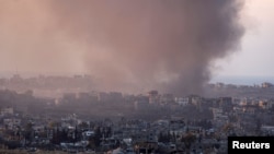 Smoke rises from Gaza, amid the ongoing conflict in Gaza between Israel and Hamas, as seen from the Israeli side of the border, Dec. 16, 2024.