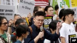 Taiwanese people gather to support Hong Kong people as the administration prepares to open debate on a highly controversial extradition law, in front of Hong Kong Economic, Trade and Culture Office in Taipei, Taiwan, June 12, 2019.