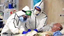 FILE - Medics tend to a patient at a hospital in Tehran, Iran, Oct. 14, 2020. (Iranian Health Ministry)