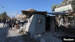 FILE - A damaged hospital hit by one of the three truck bombs in the YPG-controlled town of Tel Tamer, Syria, Dec. 11, 2015.