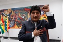 FILE - Bolivia's President Evo Morales leaves a press conference in La Paz, Bolivia, Oct. 24, 2019.