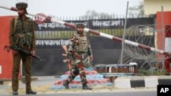 Indian soldiers take are seen outside an army camp at Nagrota, in the outskirts of Jammu, India, Nov. 29, 2016.