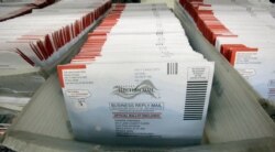 FILE - Mail-in ballots for the 2016 U.S. general election are seen at the Salt Lake County Government Center, in Salt Lake City, Utah, Nov. 1, 2016.