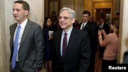 FILE - US. Supreme Court nominee Judge Merrick Garland (R) walks after a breakfast with Senate Judiciary Committee Chair Senator Chuck Grassley (R-IA) on Capitol Hill Washington, April 12, 2016. 