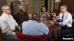 U.S. President Barack Obama visits members of middle class families to discuss his Administration's push to cut taxes for 98% of Americans while visiting in Fairfax County, Virginia, December 6, 2012.