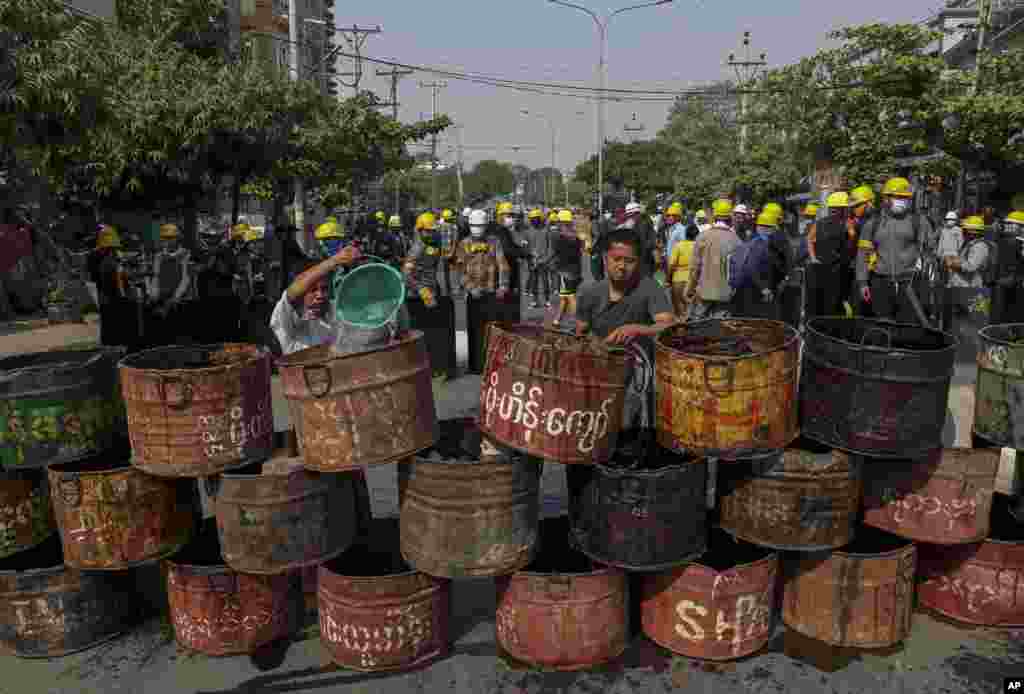 People build barricades to block police in Mandalay, Myanmar.&nbsp;Demonstrators protesting last month&#39;s military coup returned to the streets undaunted by the killing of at least 38 people the previous day by security forces.