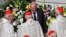 Vatican head of security Domenico Giani, top center, speaks to a group of cardinals during a canonization Mass in St. Peter's Square at the Vatican, Oct. 13, 2019.