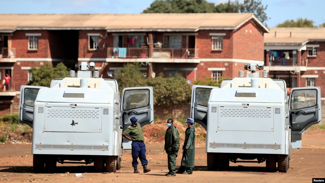 FILE - Police patrol during a 21-day nationwide lockdown called to help curb the spread of coronavirus disease, in Harare, Zimbabwe, April 3, 2020. 