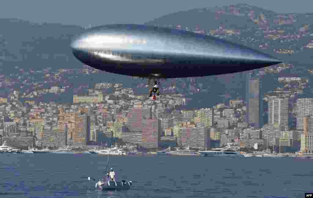 French adventurer and researcher Stephane Rousson prepares his &quot;Aerosail&quot; in Roquebrune-Cap-Martin, southeastern France prior to his planned attempt to cross the Mediterranean from Nice to Calvi, on the French Mediterraean island of Corsica. 