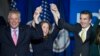 Virginia's governor-elect, Ralph Northam, right, celebrates his election win with Virginia Governor Terry McAuliffe and his wife, Dorothy, in Fairfax, Virginia. Nov. 7, 2017.