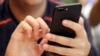 FILE - In this Sept. 16, 2017, file photo, a person uses a smartphone in Chicago.