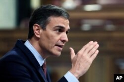 FILE - Spain's Prime Minister Pedro Sanchez speaks during a parliamentary session in Madrid, Spain, Oct. 21, 2020.