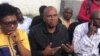 Senator Nenel Cassy, center, recounts his arrest in Miragoane during a press conference in Port su Prince, Haiti, Jan. 22, 2021. (Matiado Vilme/VOA)