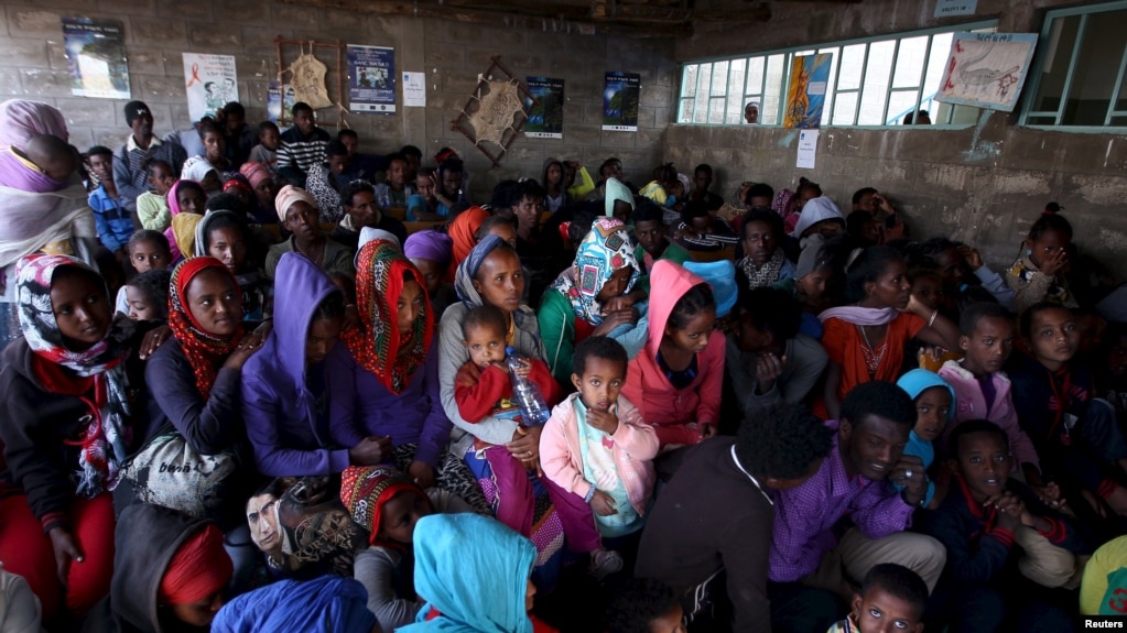 FILE - Eritrean refugees wait to get registered on arrival at the Indabaguna refugee reception and screening center in Ethiopia's Tigrai region near the Eritrean border, Feb. 9, 2016. 