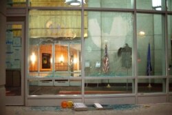 The windows of the Tommy G. Thompson Center on Public Leadership in Madison, Wis., are shattered during demonstrations June 23, 2020.