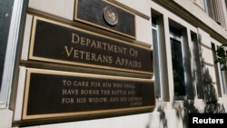 FILE - The sign of the Department of Veteran Affairs is seen in front of the headquarters building in Washington, May 23, 2014. 