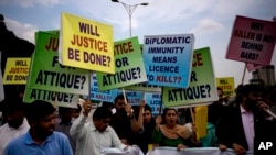 FILE - Pakistani protesters stage a rally demanding a trial for American diplomat involved in a vehicle crash that killed a person, in Islamabad, Pakistan, April 10, 2018. Two people were injured Sunday in a second such incident involving a U.S. diplomat. 