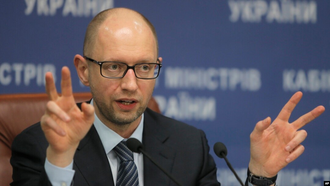 FILE - Ukrainian Prime Minister Arseniy Yatseniuk speaks to the media during a press conference in Kyiv, Ukraine, Nov. 20, 2014. 