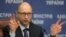 FILE - Ukrainian Prime Minister Arseniy Yatseniuk speaks to the media during a press conference in Kyiv, Ukraine, Nov. 20, 2014. 
