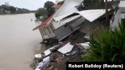 A destroyed house is seen after a tropical depression descended upon Daet, Camarines Norte, the Philippines, Dec. 30, 2018.