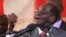 Zimbawe's president, Robert Mugabe, gestures as he addresses supporters of his ruling ZANU-PF party at Harare International Airport, Zimbabwe, Sept. 24, 2016. 
