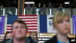 Voters look on as Democratic presidential candidate Sen. Bernie Sanders speaks during a campaign a campaign event, Jan. 29, 2016, in Mt. Pleasant, Iowa