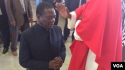 FILE: Vice president Emmerson Mnangagwa praying at a Catholic Church.