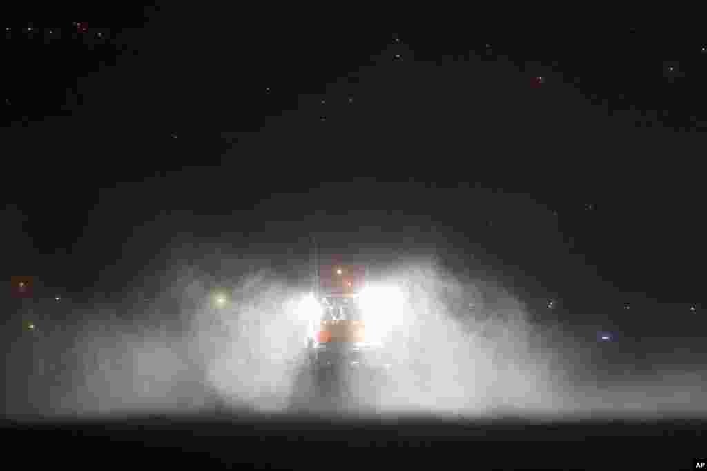 A fishing boat endures heavy rain and strong winds while moored at the port in Horta, off the Portuguese island of Faial. Hurricane Lorenzo is lashing the mid-Atlantic Azores Islands with heavy rain, powerful winds and high waves.