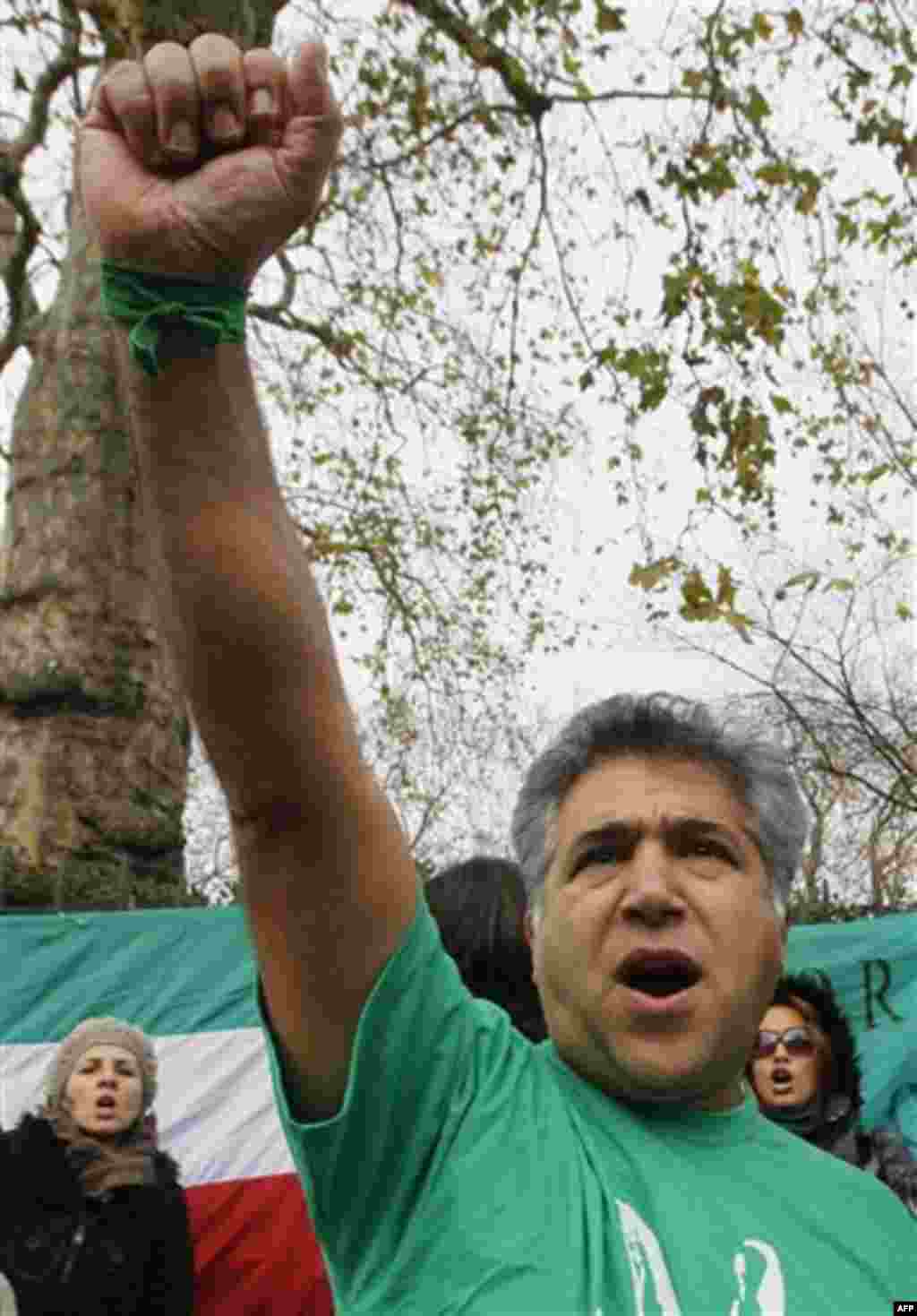 An anti Iranian government protestor demonstrates outside the Iranian embassy in London, Friday, Dec. 2, 2011. Britain's foreign secretary on Wednesday ordered all Iranian diplomats out of the U.K within 48 hours following attacks on the British embassy 