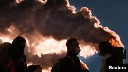 FILE - Delegates are seen at the UN Climate Change Conference (COP26), in Glasgow, Scotland, Britain Nov. 12, 2021. 