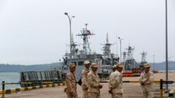 FILE - Sailors stand guard near petrol boats at the Cambodian Ream Naval Base in Sihanoukville, Cambodia, July 26, 2019. (REUTERS)