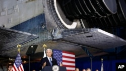 Vice President Mike Pence speaks during the sixth meeting of the National Space Council beneath NASA's Space Shuttle Discovery at the National Air and Space Museum's Steven F. Udvar-Hazy Center in Chantilly, Va., Aug. 20, 2019.