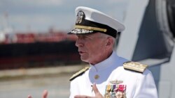 FILE - In this July 27, 2019 photo, Admiral Craig Faller, commander of U.S. Southern Command, speaks with the news media following a commissioning ceremony for the USS Paul Ignatius, at Port Everglades in Fort Lauderdale, Fla.