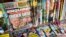 FILE - This July 12, 2017, file photo shows the cover of an issue of the National Enquirer featuring President Donald Trump at a store in New York. Karen McDougal, a former Playboy model who said she had a 10-month affair with Trump, setttled her lawsuit on April 18, 2018, with the supermarket tabloid.