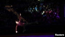 Maxim Naumov performs a tribute to his parents, Vadim Naumov and Evgenia Shishkova, during the Legacy on Ice benefit at Capital One Arena in Washington, D.C. (Geoff Burke-Imagn Images)