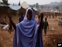 FILE — A woman cries as she calls out to the government to help and rescue school children that were kidnapped by gunmen in Chikun, Nigeria, March. 7, 2024.