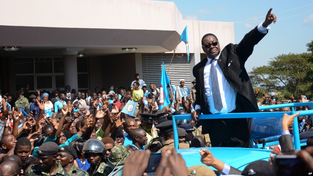 FILE - Newly elected Malawian president Peter Mutharika greets supporters after he was sworn in at the High Court in Blantyre, Malawi, May 31, 2014.